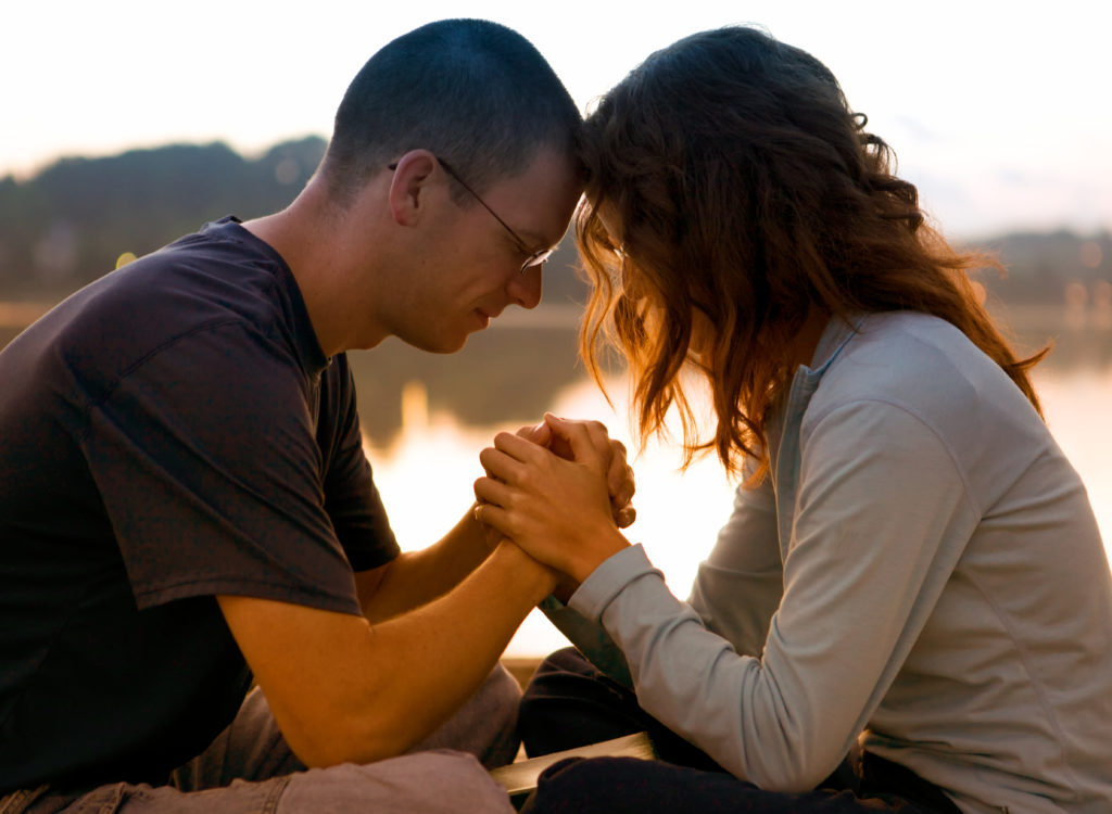 Couple Praying Together | Abundant Grace International